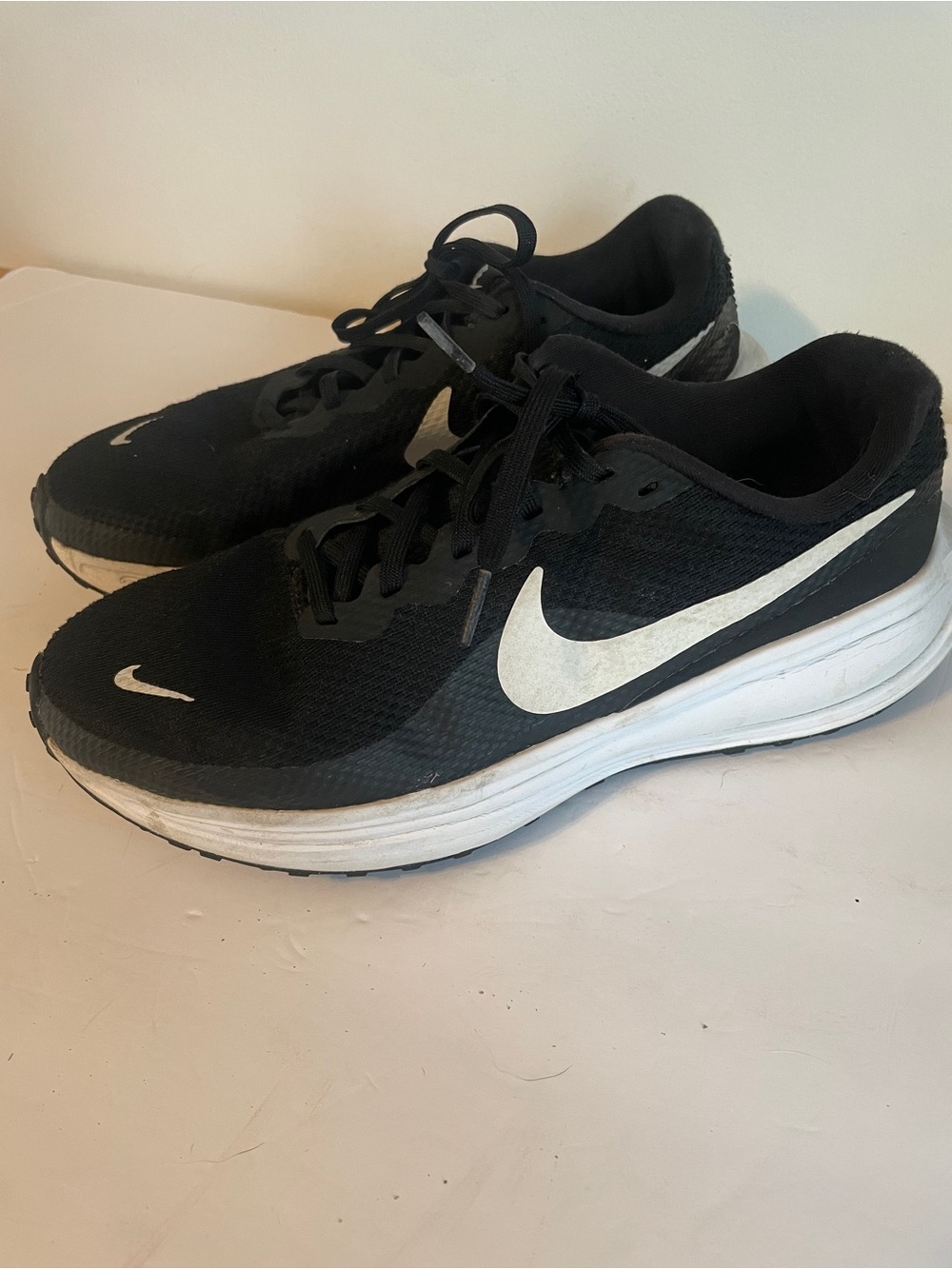 Nike Women’s Black Running Sneakers with White Swoosh